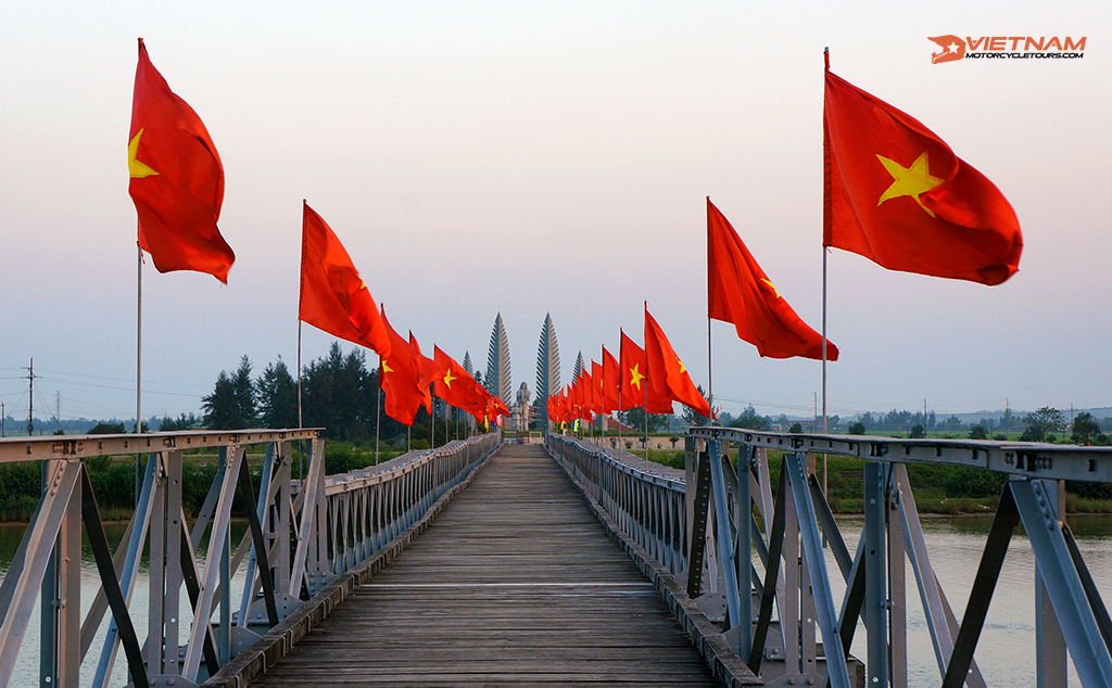 Quang Tri, Vietnam - 2013: Vietnam flags on Hien Luong bridge.